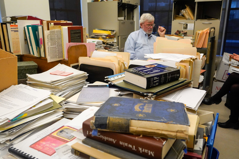 Books, research, and correspondence fill Bob Hirst’s office in the project’s headquarters.