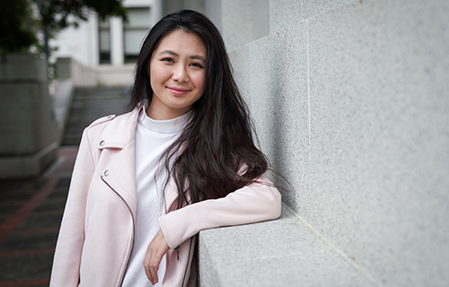 Library undergraduate fellow Alicia Auduong poses for a portrait outside Doe Library on April 18, 2018. (Photo by Jami Smith for the UC Berkeley Library)