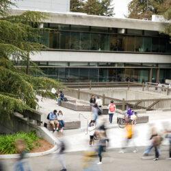 People walking outside the Moffitt Library on the Berkeley campus